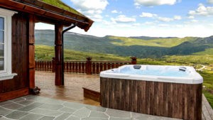 Hot tub on patio, overlooking green rolling hills